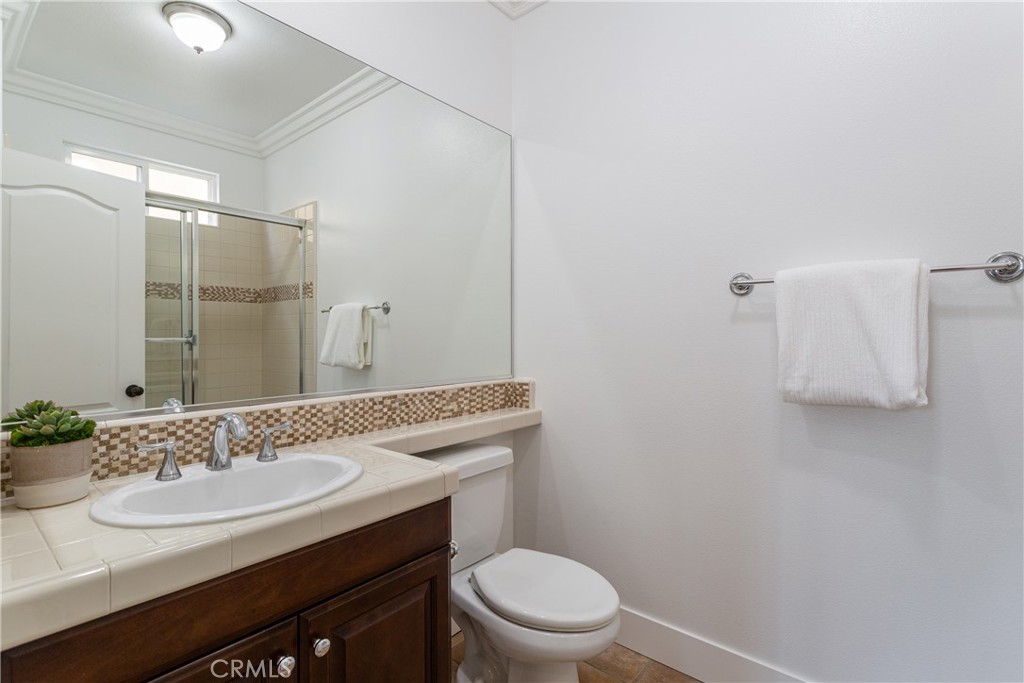 308 Via Los Tilos San Clemente, CA 92673 - Photo 18 of 43 a bathroom with a sink toilet vanity and shower
