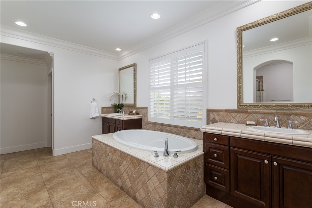 308 Via Los Tilos San Clemente, CA 92673 - Photo 22 of 43 a spacious bathroom with a sink a mirror and a bathtub
