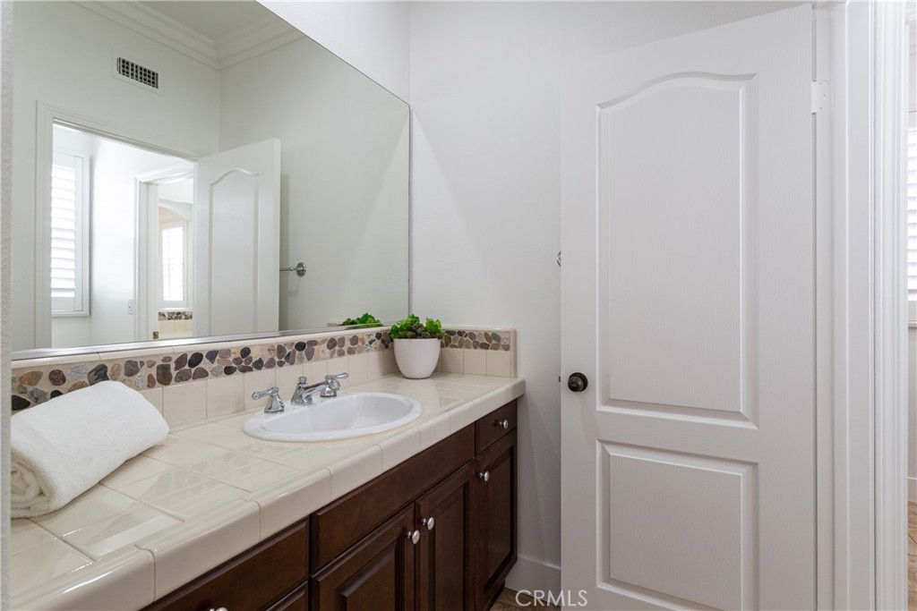 308 Via Los Tilos San Clemente, CA 92673 - Photo 29 of 43 a bathroom with a sink and a mirror