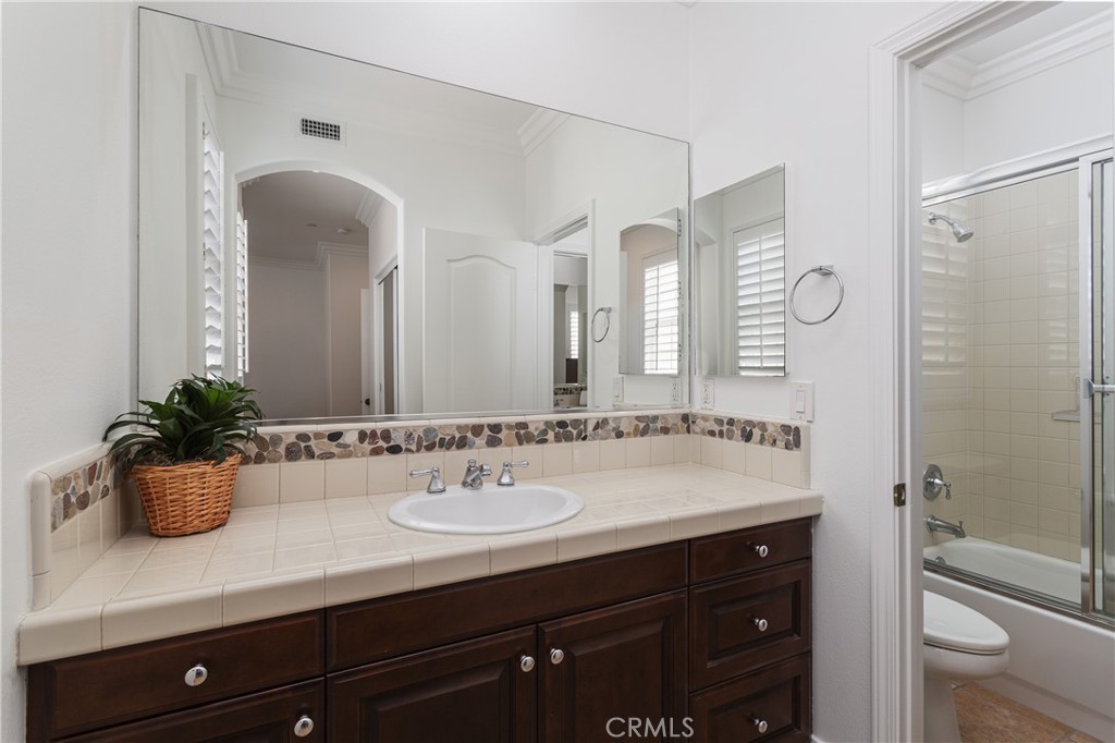 308 Via Los Tilos San Clemente, CA 92673 - Photo 30 of 43 a bathroom with a sink a toilet and shower