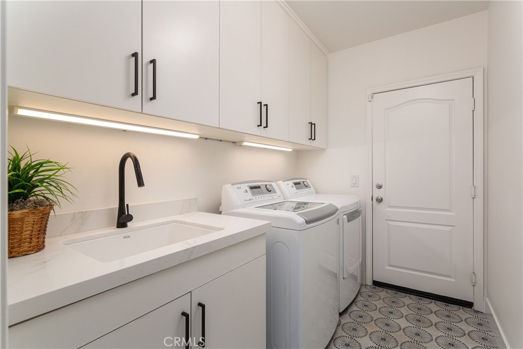 308 Via Los Tilos San Clemente, CA 92673 - Photo 31 of 43 a view of a sink and dishwasher with white cabinets