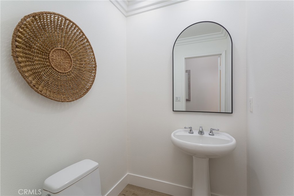 308 Via Los Tilos San Clemente, CA 92673 - Photo 32 of 43 a bathroom with a toilet sink and mirror
