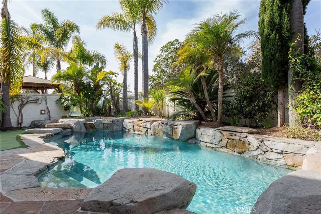 308 Via Los Tilos San Clemente, CA 92673 - Photo 34 of 43 a view of a backyard with a garden and swimming pool