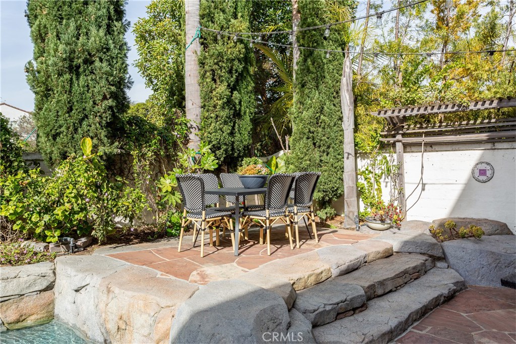 308 Via Los Tilos San Clemente, CA 92673 - Photo 37 of 43 a view of a patio with table and chairs and potted plants