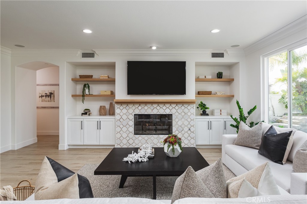 308 Via Los Tilos San Clemente, CA 92673 - Photo 4 of 43 a living room with furniture a flat screen tv and a fireplace