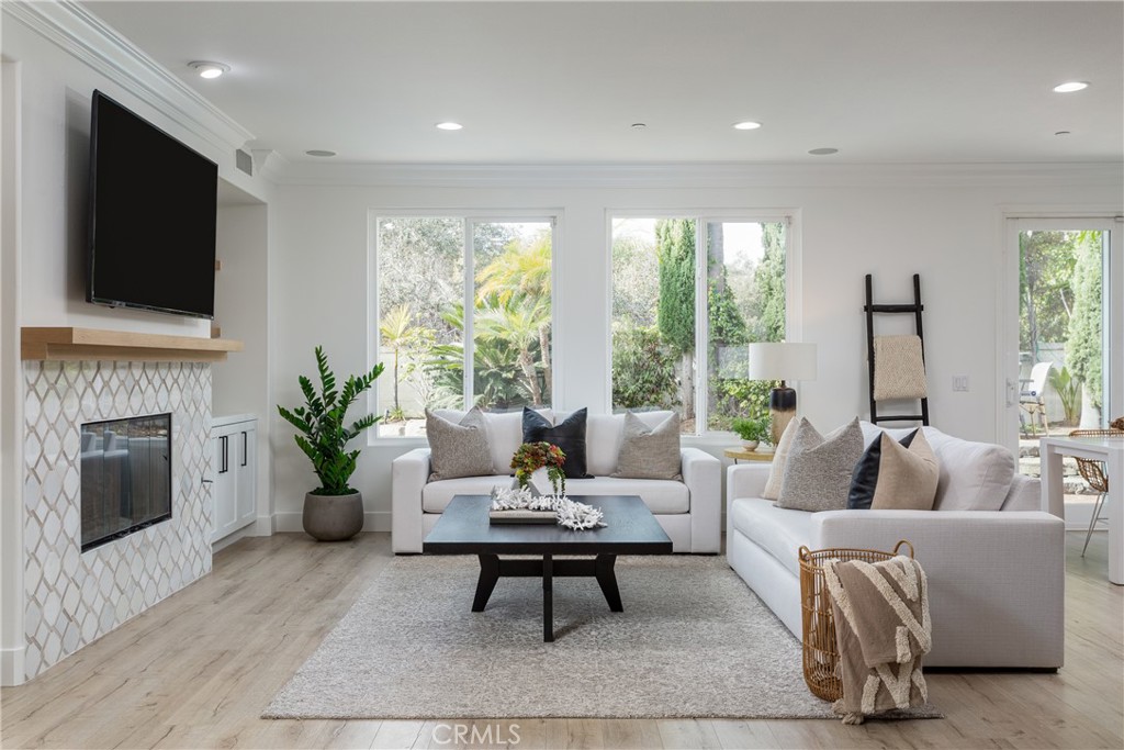308 Via Los Tilos San Clemente, CA 92673 - Photo 6 of 43 a living room with furniture a flat screen tv and a fireplace