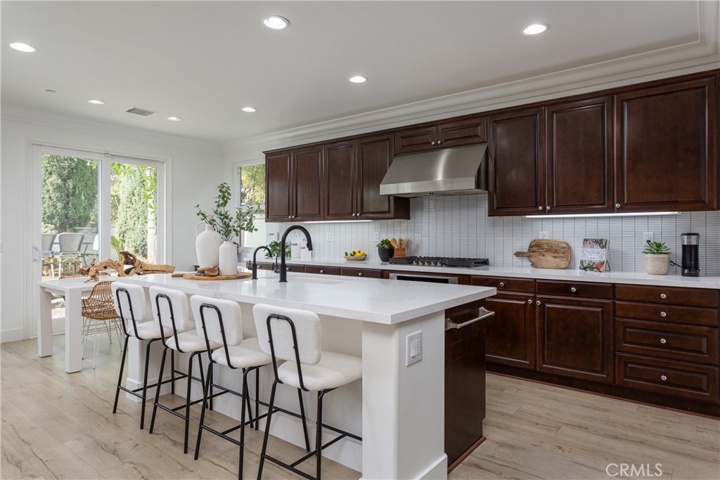 308 Via Los Tilos San Clemente, CA 92673 - Photo 10 of 43 a kitchen with stainless steel appliances granite countertop wooden cabinets a sink and a stove