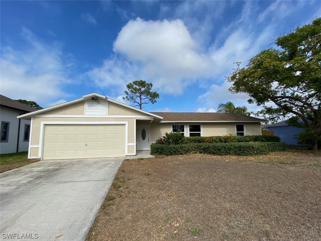 18258 Maple Road Fort Myers, FL 33967 - Photo 1 of 14 front view of a house with a yard