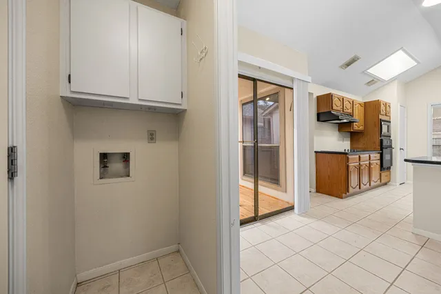 a view of a kitchen with electric appliances