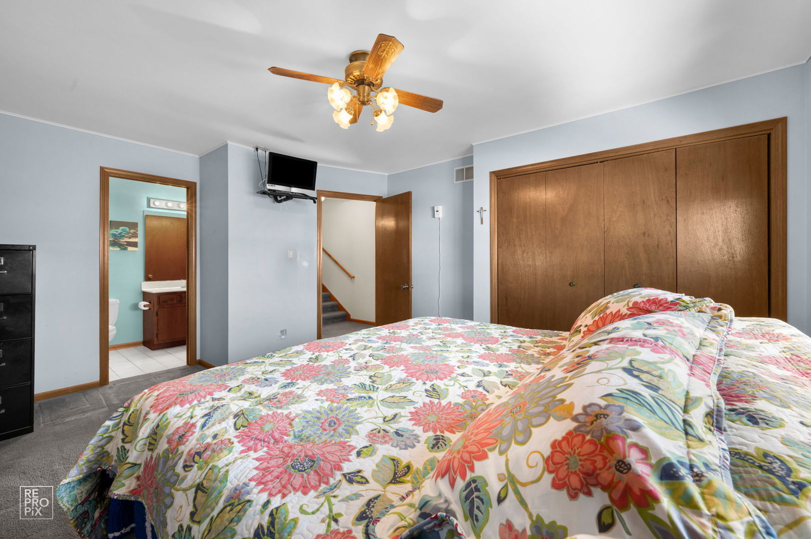 3235 192nd Street Lansing, IL 60438 - Photo 8 of 28 a bedroom with a bed and a chandelier
