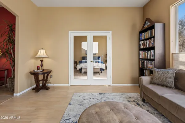 a bedroom with furniture and a rug