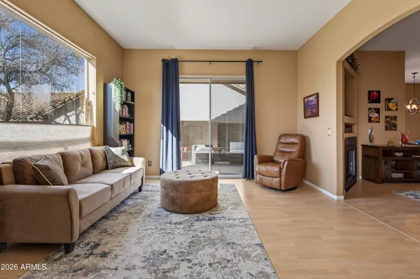a living room with furniture and a large window