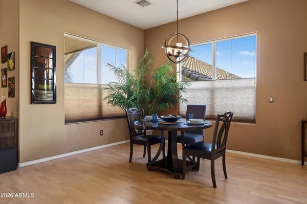 a view of a dining room with furniture and wooden floor
