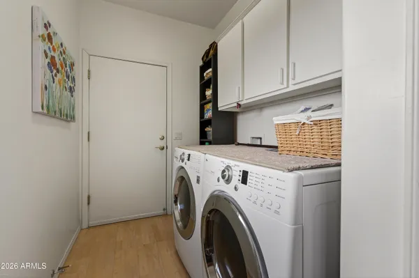 a utility room with dryer and washer