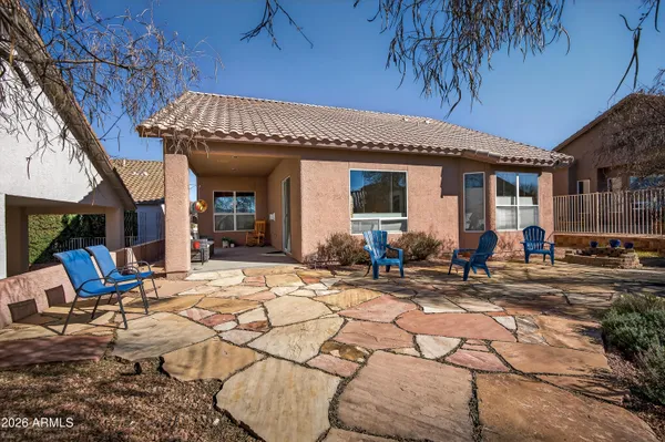 a view of a dinning table and chairs in the patio