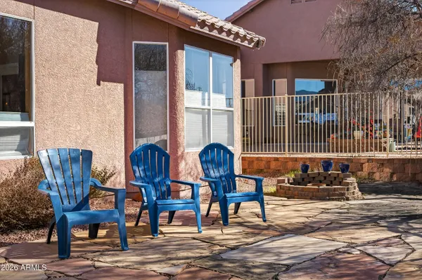 a view of a chairs and table in the patio