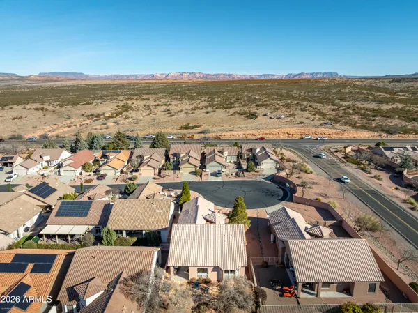 an aerial view of residential building and ocean