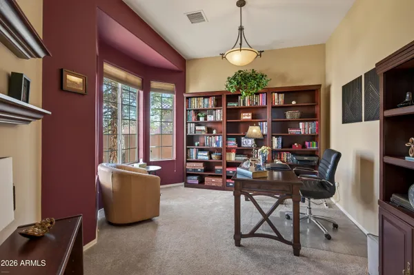 a view of a workspace with furniture