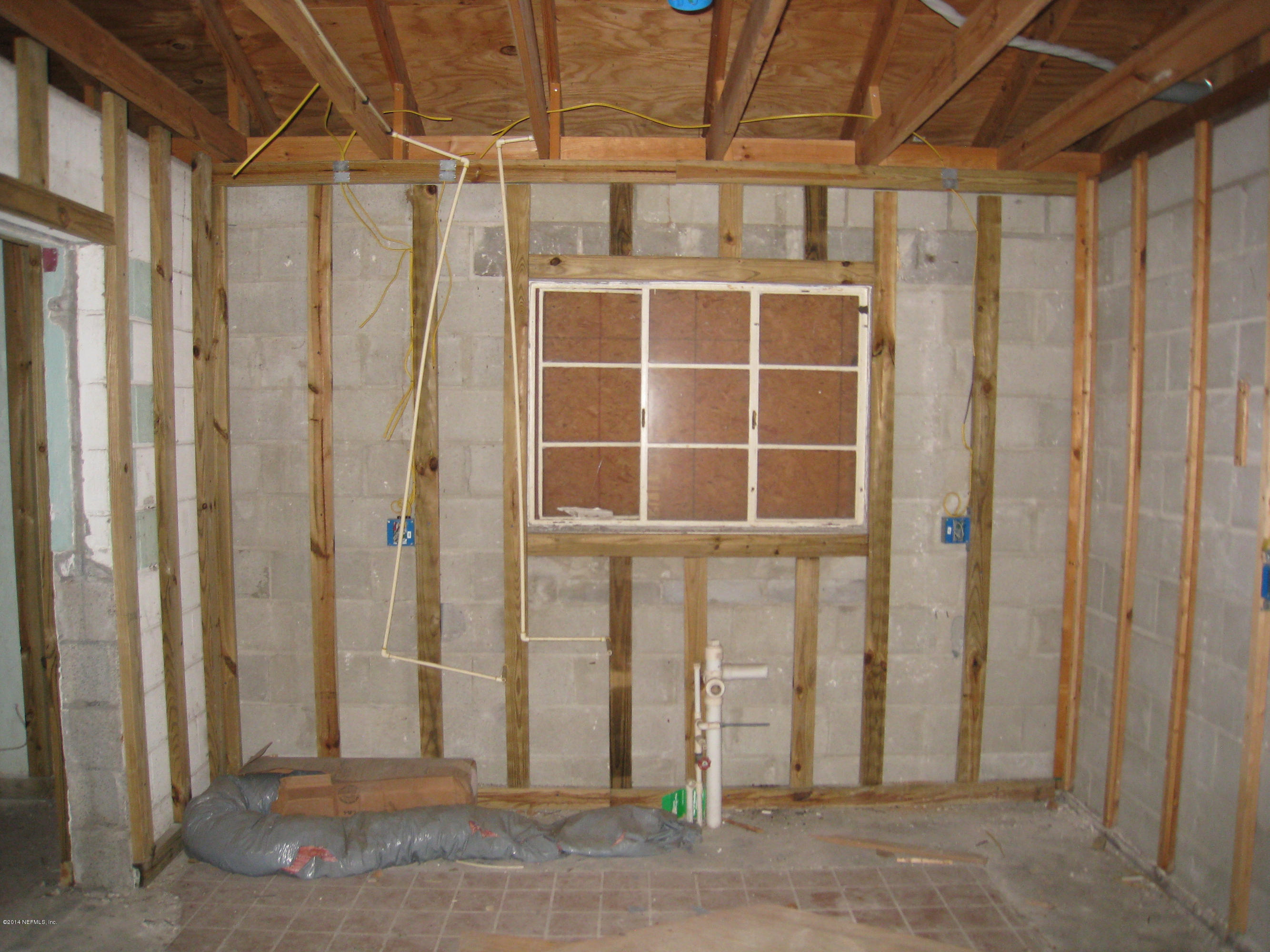 1369 Griflet Road Jacksonville, FL 32211 - Photo 7 of 16 a view of a house with a wooden door