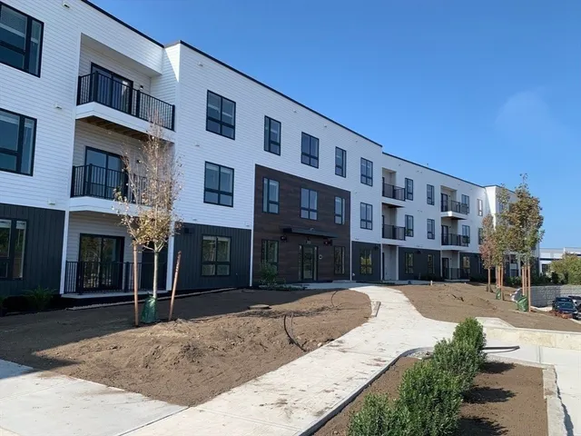 a view of a building with a yard