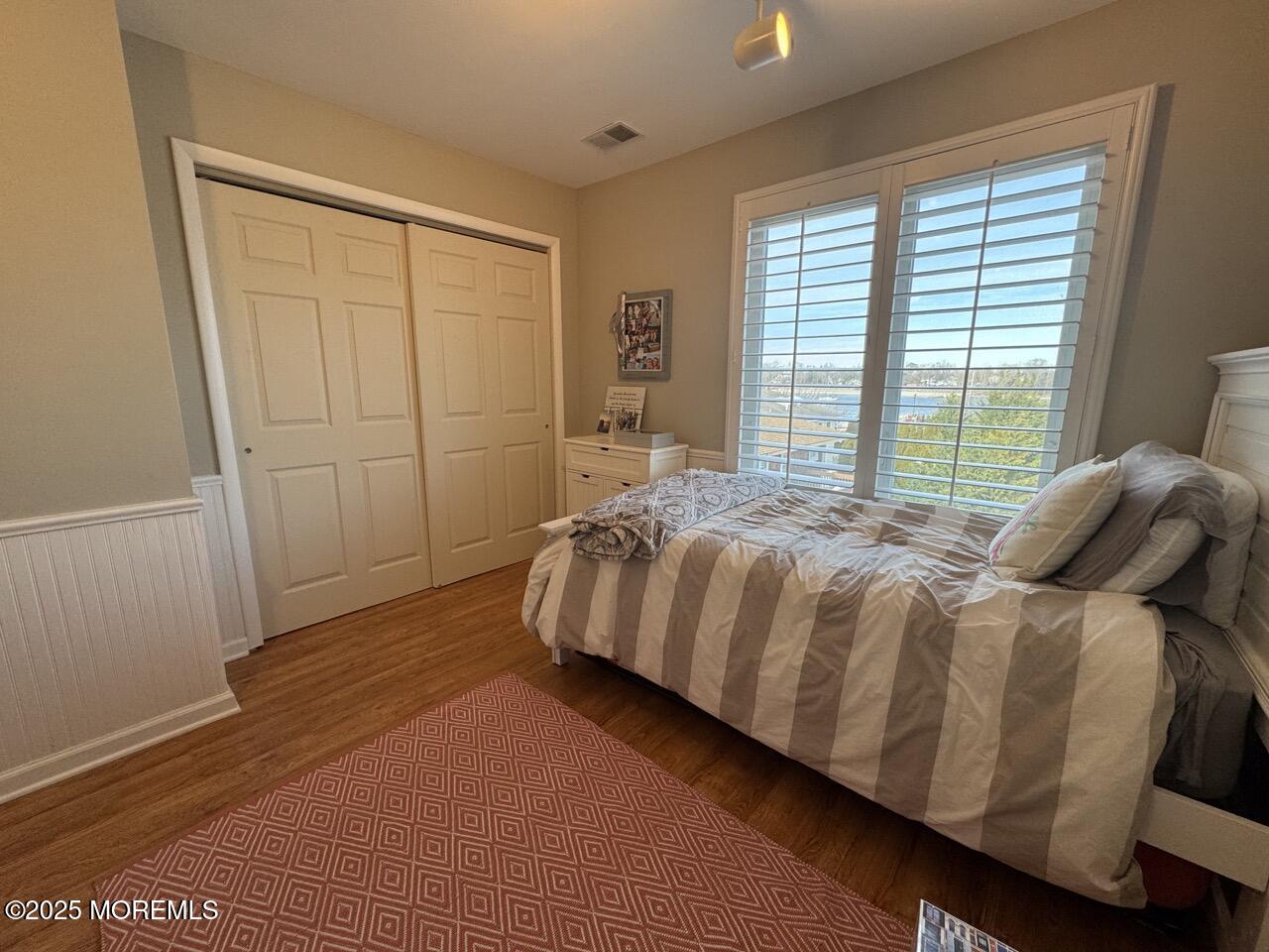 200 South Concourse, Unit 8 Neptune Township, NJ 07753 - Photo 11 of 17 a bed sitting in a bedroom next to a window