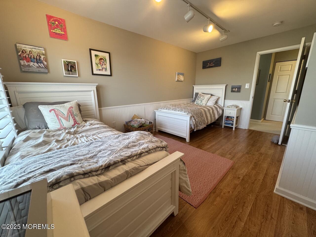 200 South Concourse, Unit 8 Neptune Township, NJ 07753 - Photo 12 of 17 a bedroom with bed and wooden floor