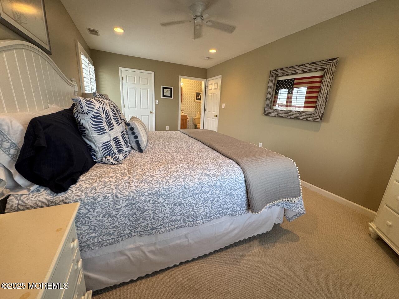 200 South Concourse, Unit 8 Neptune Township, NJ 07753 - Photo 14 of 17 a bedroom with a bed and a chandelier