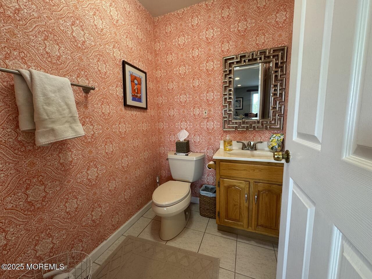 200 South Concourse, Unit 8 Neptune Township, NJ 07753 - Photo 8 of 17 a bathroom with a toilet sink and mirror