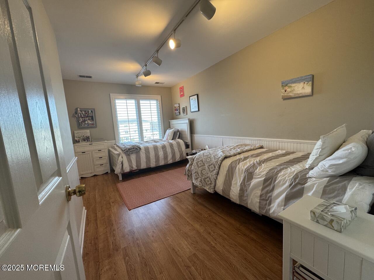 200 South Concourse, Unit 8 Neptune Township, NJ 07753 - Photo 10 of 17 a bedroom with a bed and wooden floor