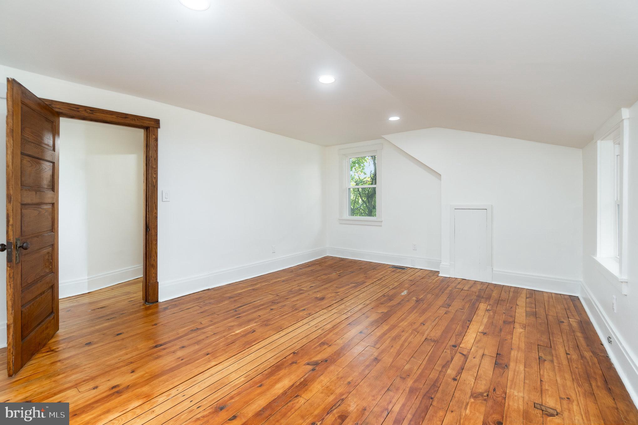 699 North Front Street Liverpool, PA 17045 - Photo 28 of 44 an empty room with wooden floor and windows