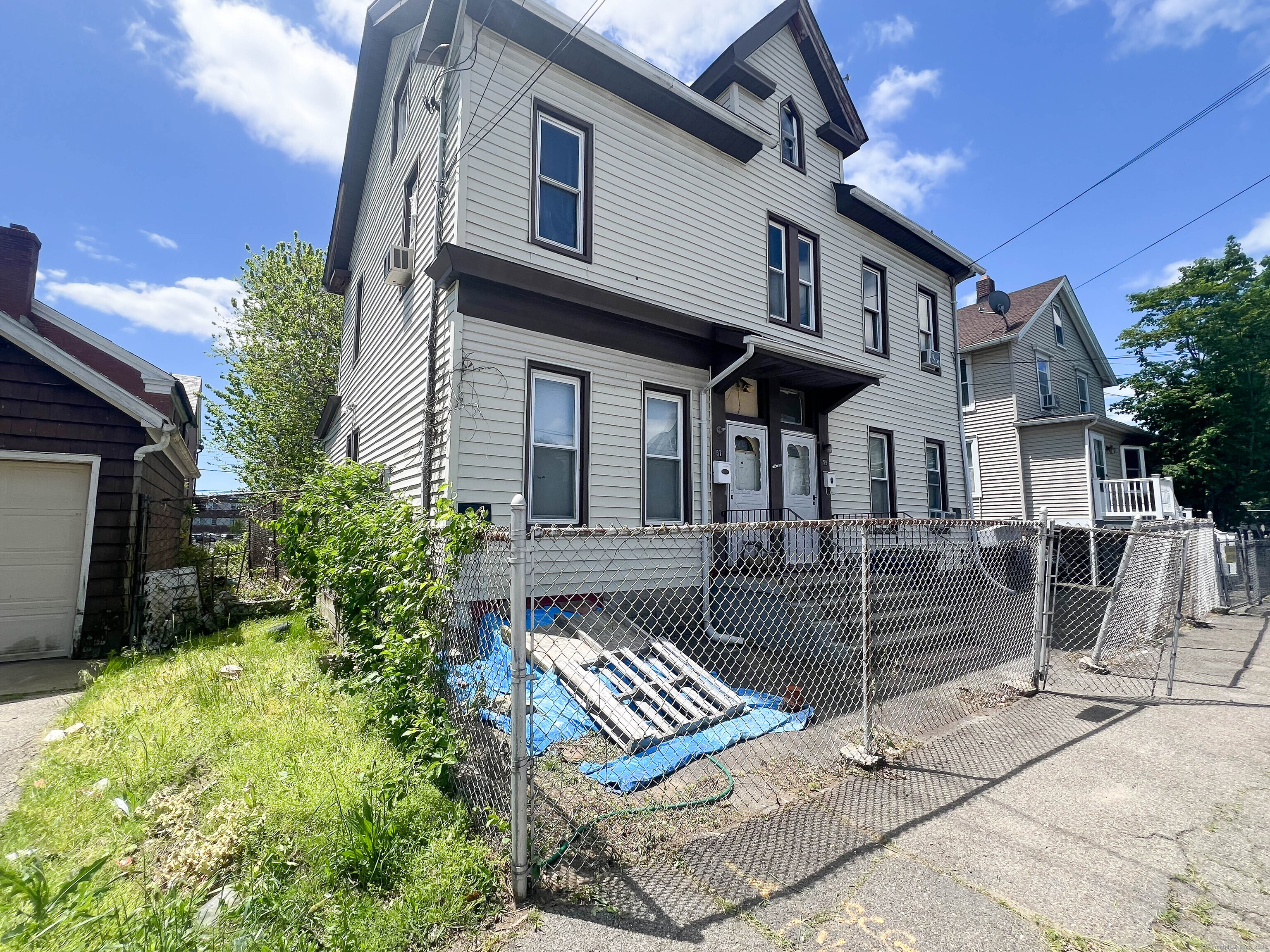 57 Milne Street Bridgeport, CT 06604 - Photo 1 of 1 a view of a house with a patio