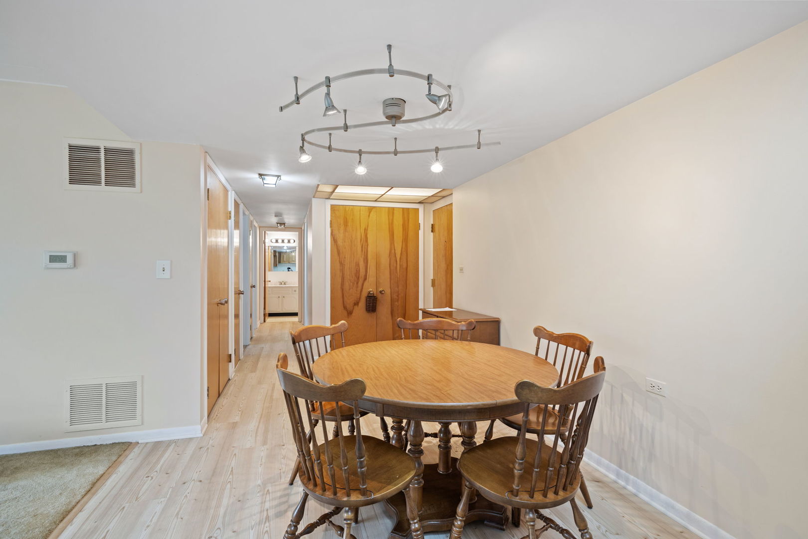 5540 Walnut Avenue, Unit 11B Downers Grove, IL 60515 - Photo 2 of 27 a view of a dining room with furniture and wooden floor