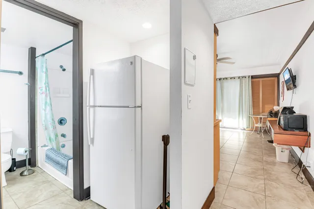 a view of a bathroom with a shower and a sink