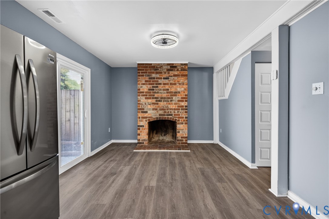 10050 Purcell Road Richmond, VA 23228 - Photo 11 of 26 a view of a livingroom with a fireplace and window