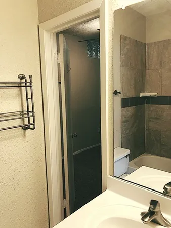 a view of an empty room with a window