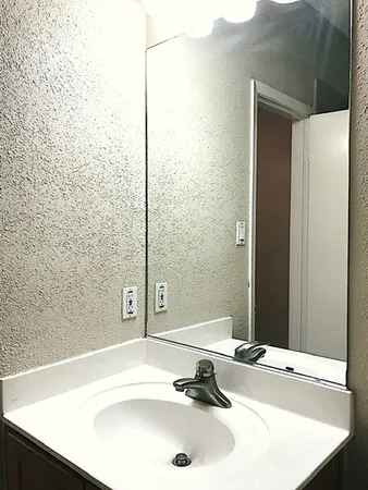 a bathroom with a sink and a bathtub