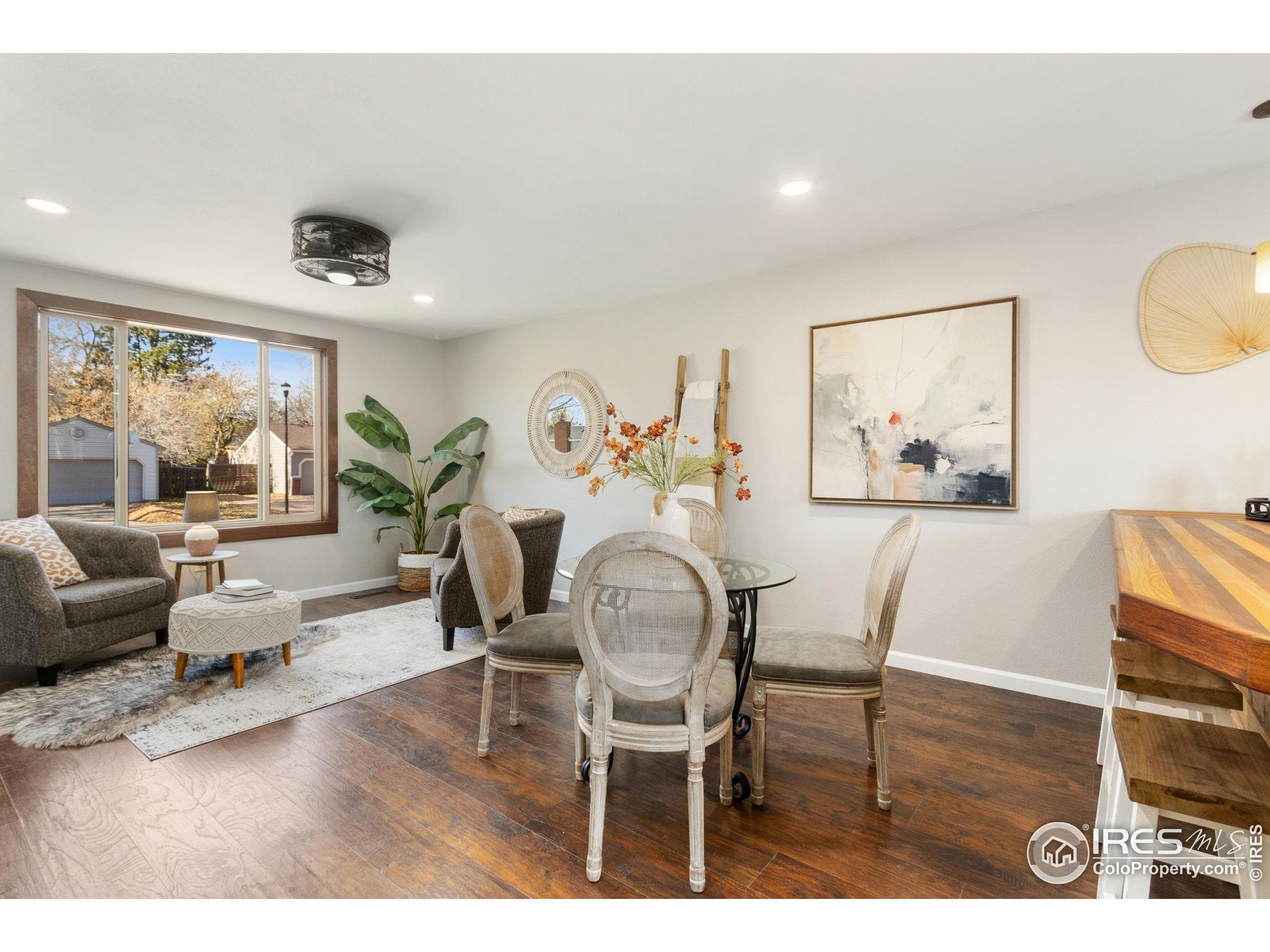 3024 Placer Court Fort Collins, CO 80526 - Photo 11 of 40 a living room with furniture and a painting on the wall