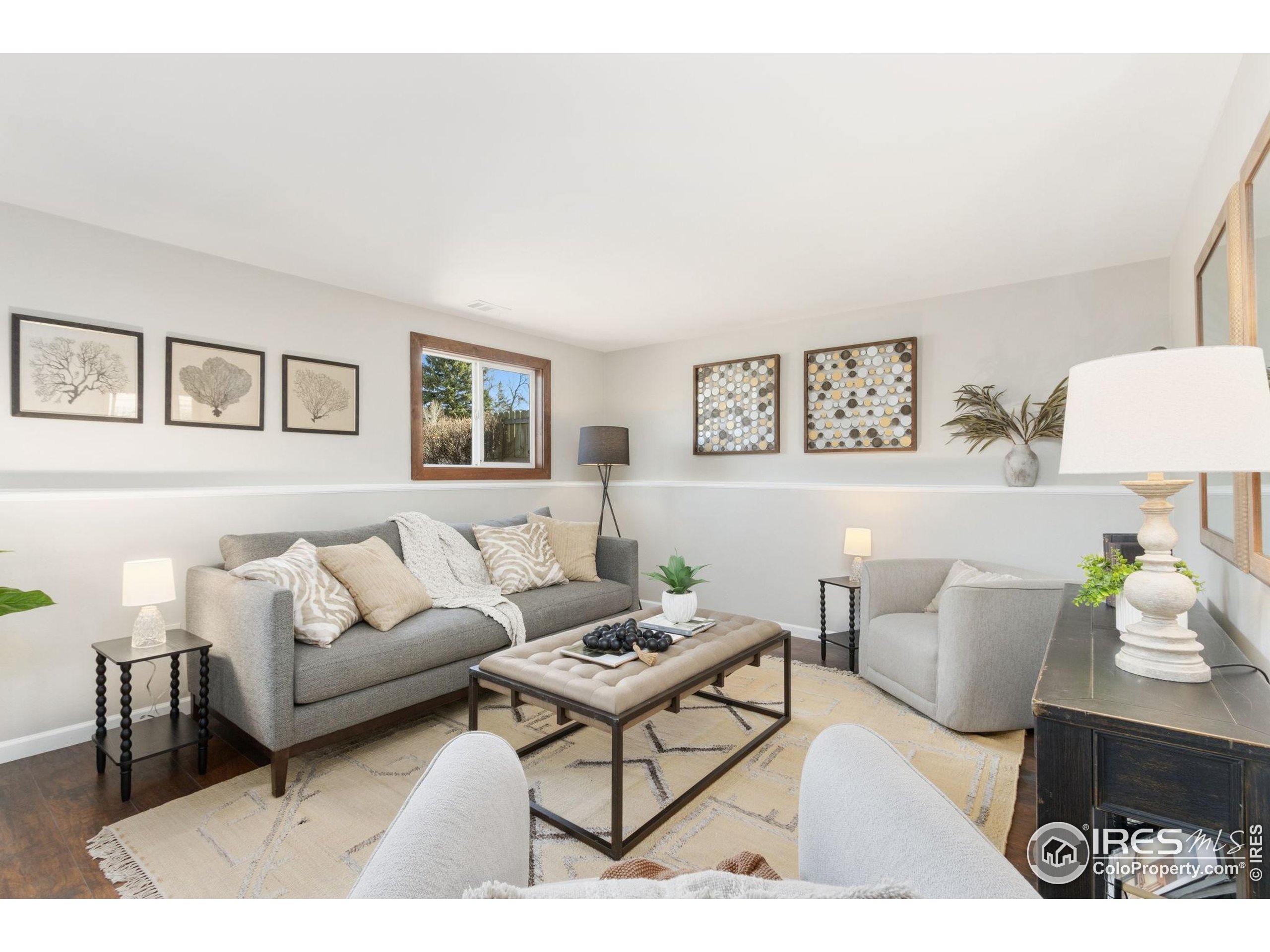 3024 Placer Court Fort Collins, CO 80526 - Photo 24 of 40 a living room with furniture and painting on the wall