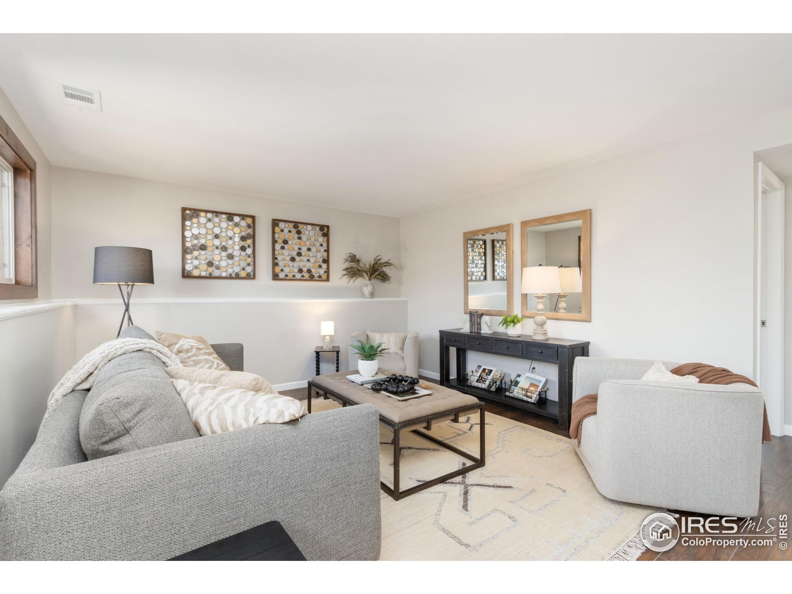 3024 Placer Court Fort Collins, CO 80526 - Photo 25 of 40 a living room with furniture and a window