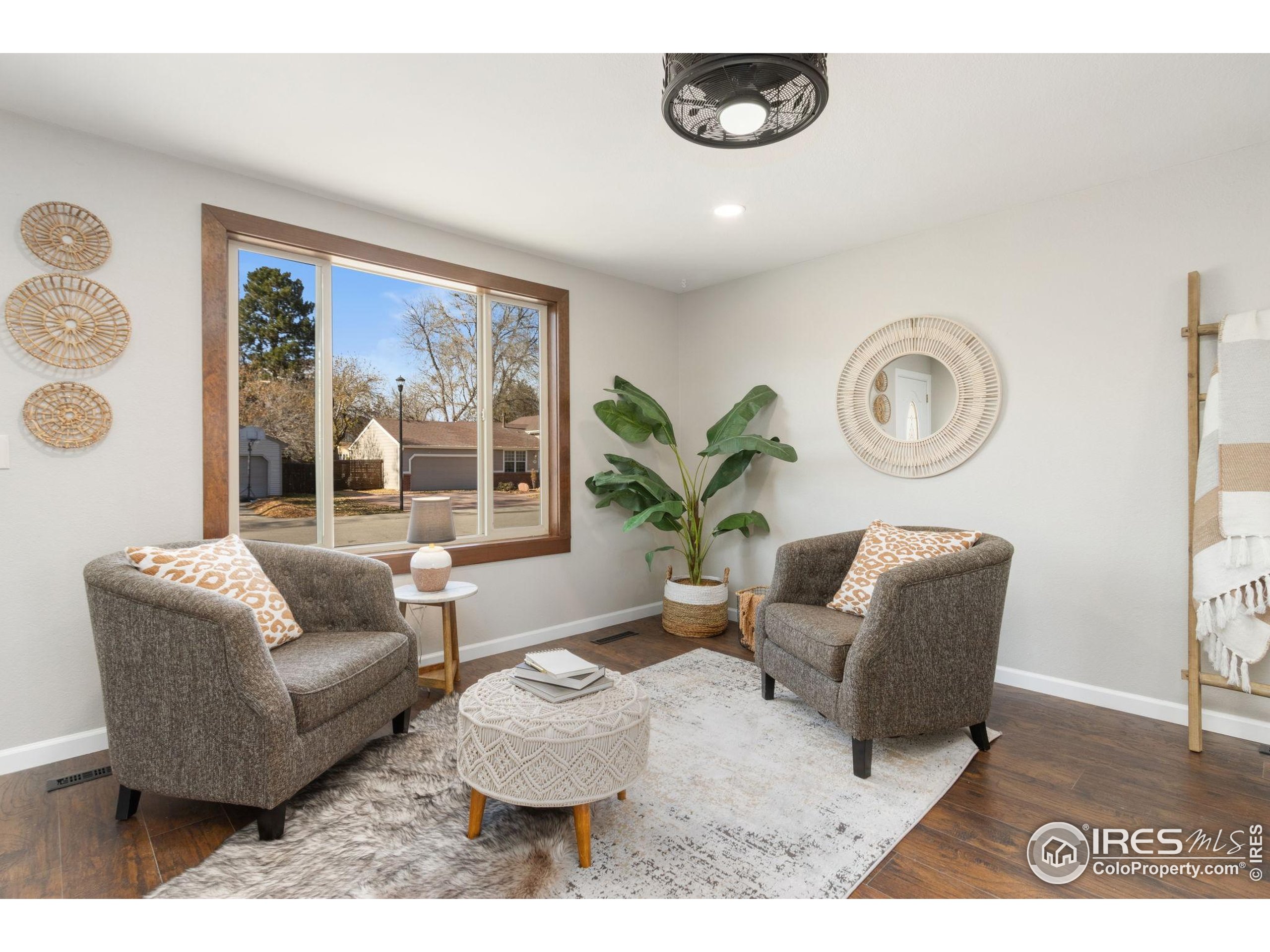 3024 Placer Court Fort Collins, CO 80526 - Photo 6 of 40 a living room with furniture and a large window