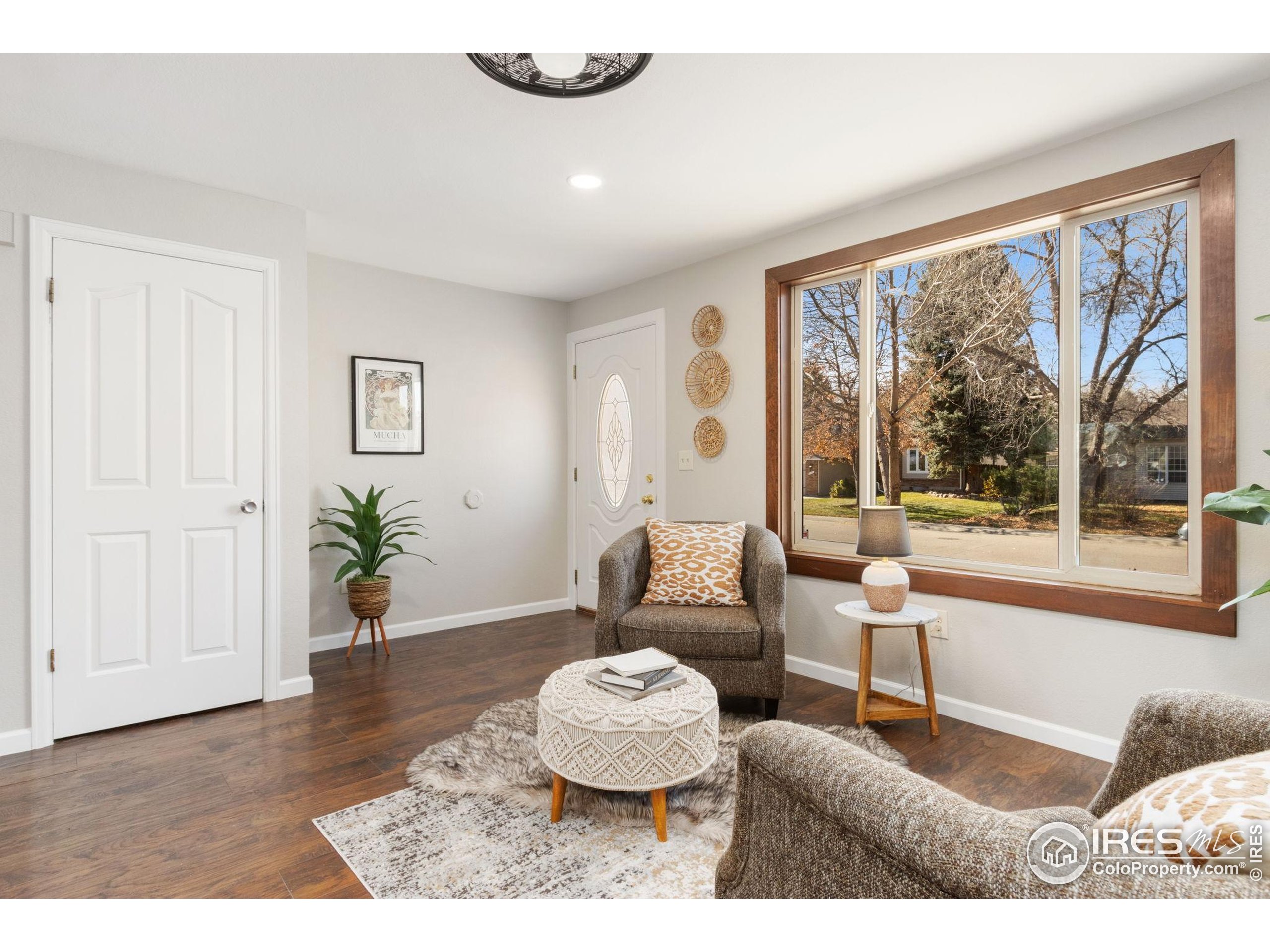3024 Placer Court Fort Collins, CO 80526 - Photo 7 of 40 a living room with furniture and a large window
