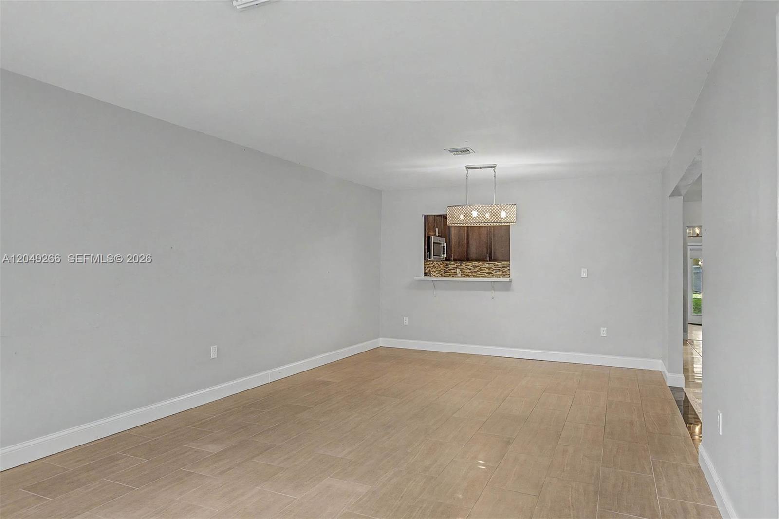 11860 Southwest 81st Road, Unit 11860 Pinecrest, FL 33156 - Photo 5 of 24 Dining/Living/Family