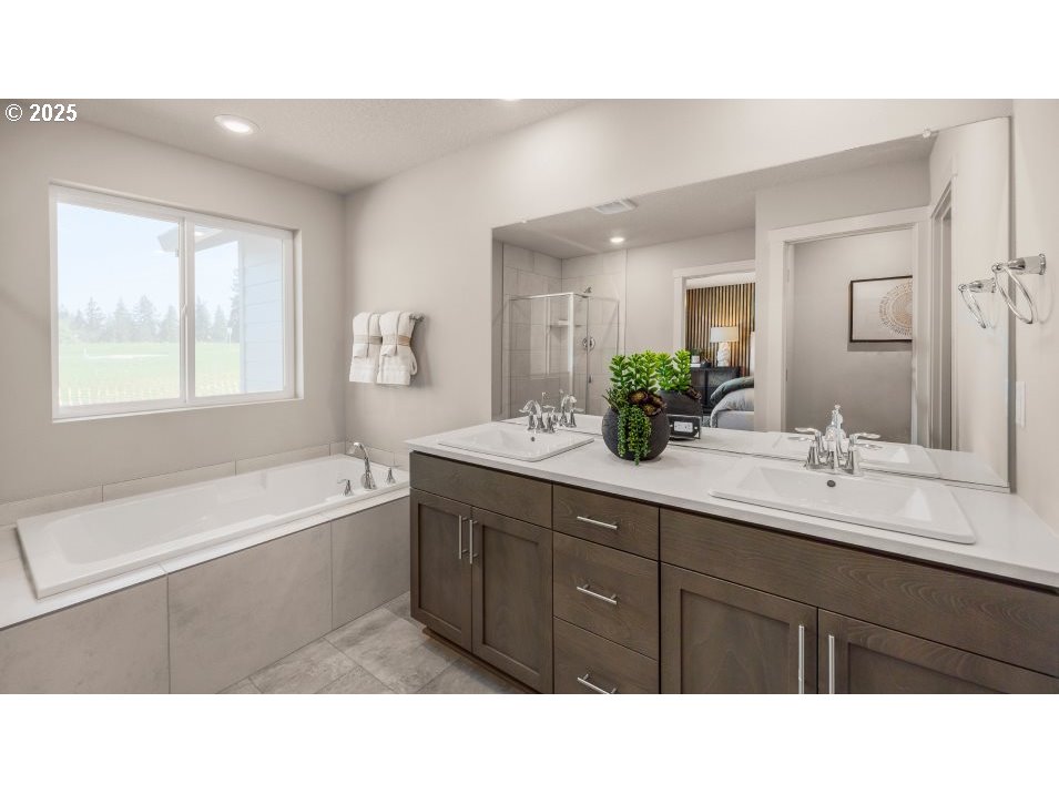 2600 South 6th Way Ridgefield, WA 98642 - Photo 12 of 33 a bathroom with a sink double vanity granite tub shower and a mirror