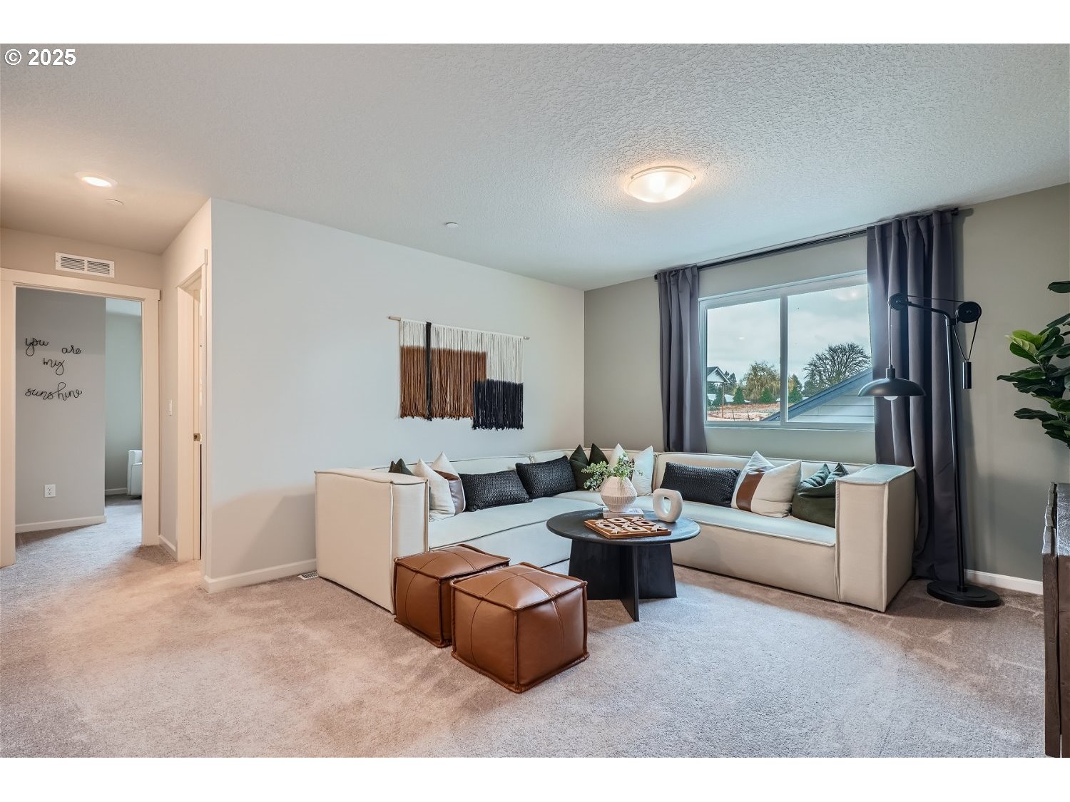 2600 South 6th Way Ridgefield, WA 98642 - Photo 17 of 33 a living room with furniture and a flat screen tv