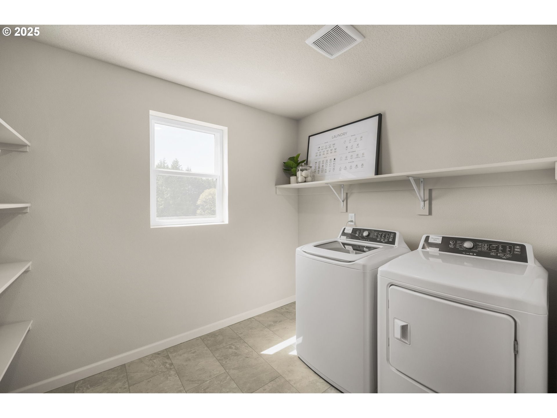 2600 South 6th Way Ridgefield, WA 98642 - Photo 19 of 33 a utility room with dryer washer and a view of living room