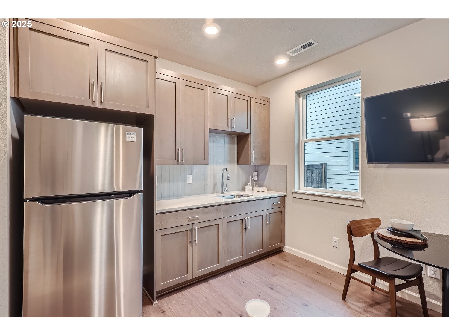 2600 South 6th Way Ridgefield, WA 98642 - Photo 21 of 33 a kitchen with stainless steel appliances a refrigerator sink and cabinets