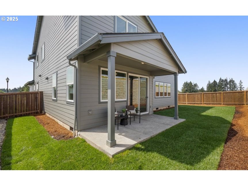 2600 South 6th Way Ridgefield, WA 98642 - Photo 23 of 33 a backyard of a house with table and chairs