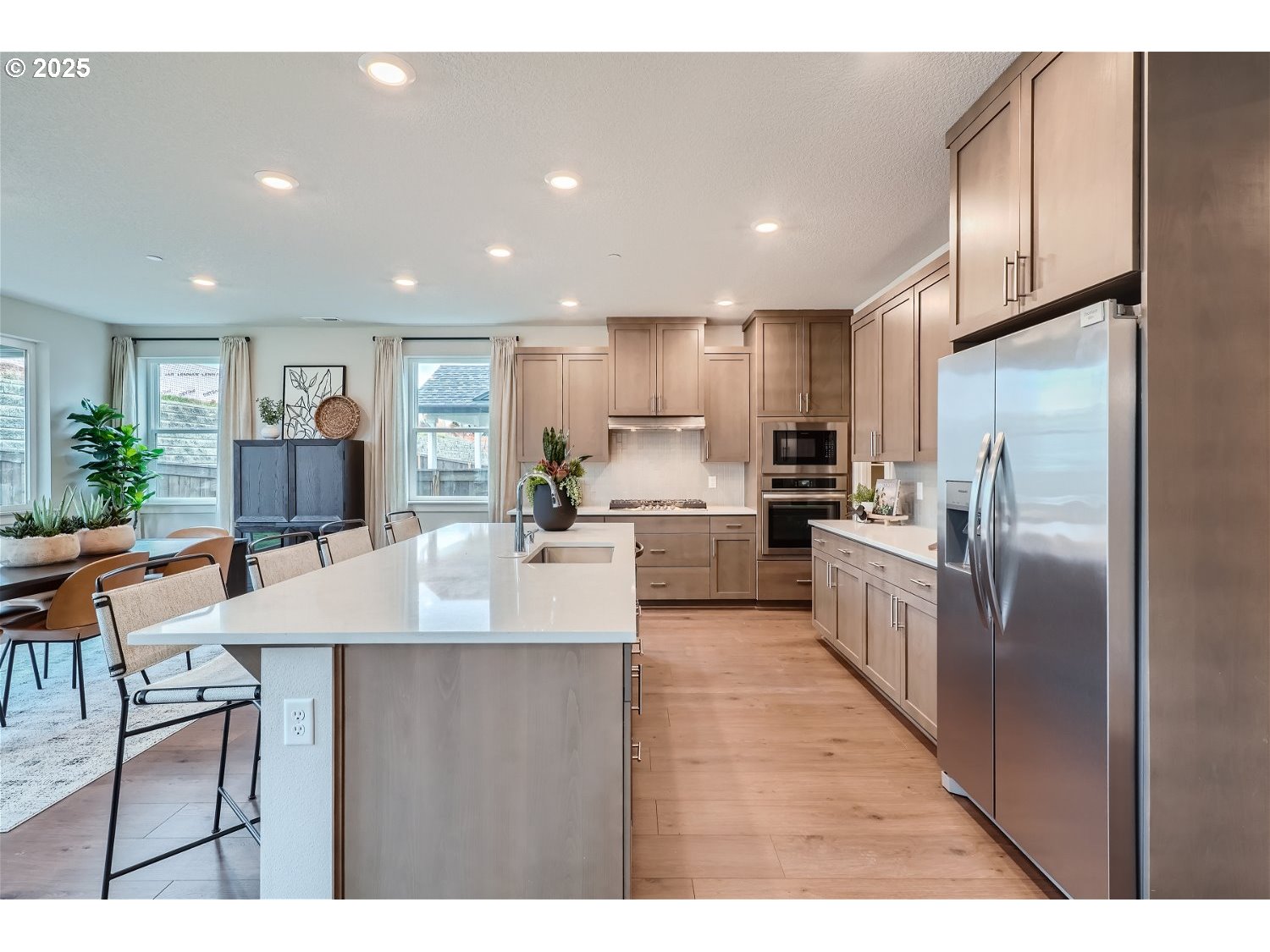 2600 South 6th Way Ridgefield, WA 98642 - Photo 6 of 33 a large kitchen with stainless steel appliances lots of counter space and a refrigerator