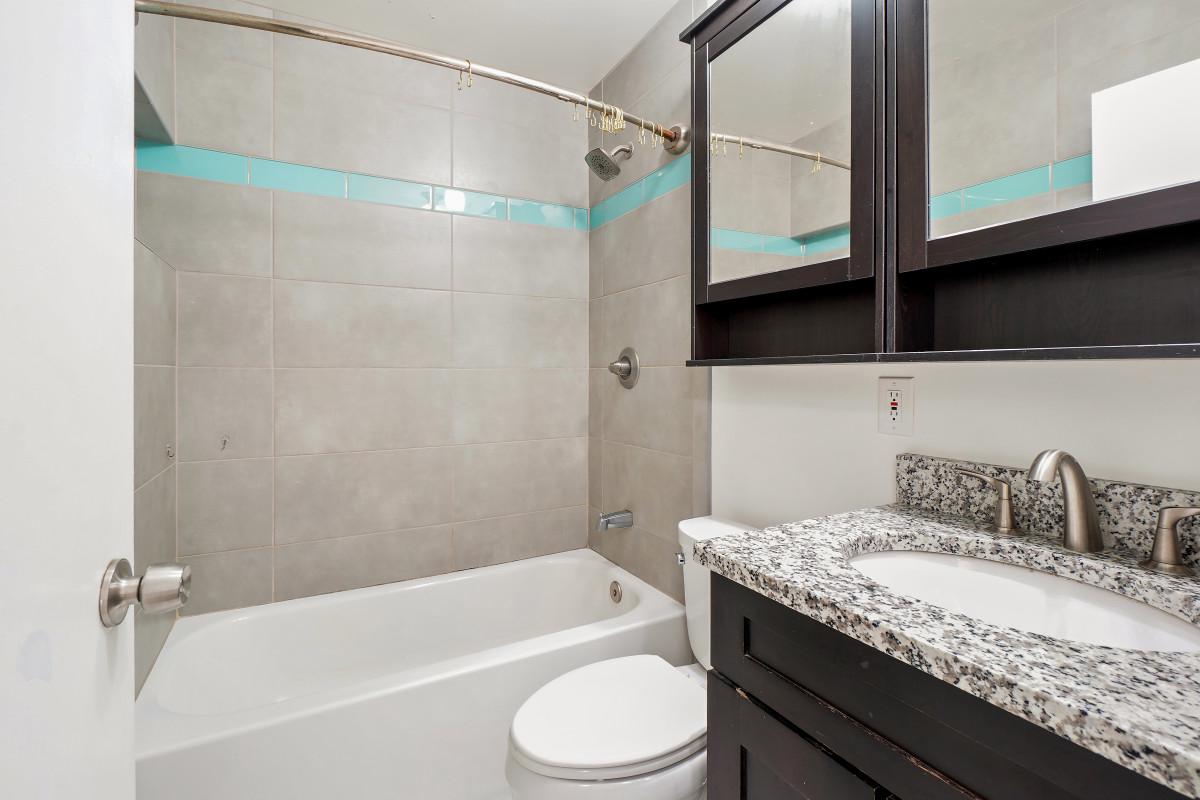35 Bellfalls Way Nottingham, MD 21236 - Photo 22 of 30 a bathroom with a granite countertop sink toilet and shower