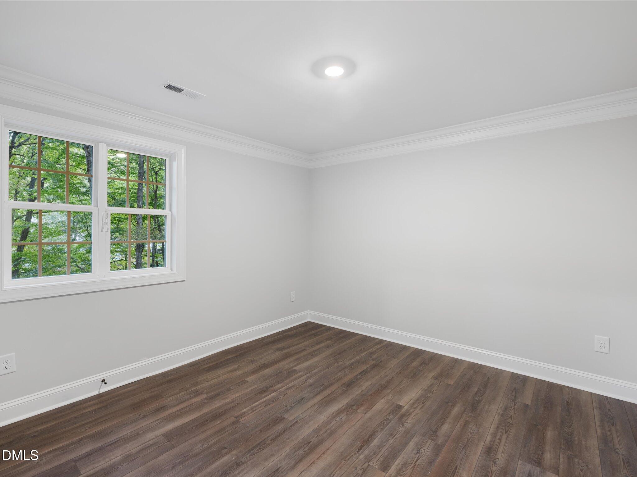 316 Howland Avenue Cary, NC 27513 - Photo 11 of 34 wooden floor in an empty room with a window